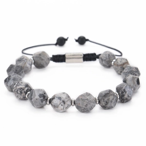 Detailed view of faceted sodalite stone beads and adjustable black woven cord bracelet