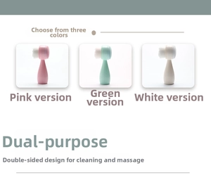 Double-sided manual facial cleansing brush in pink, green, and white for massage and skin care