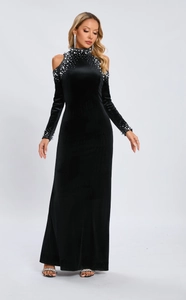 Detail of high neck black velvet dress with pearl embellishments on shoulder and neckline