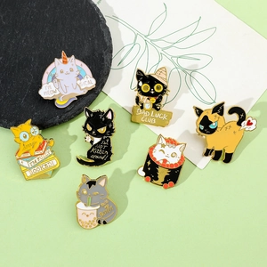 Detailed view of seven colorful enamel cat pins with funny meow phrases on a stone tray