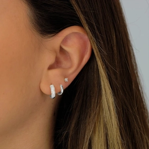 Three-piece S925 sterling silver earring set featuring hoop and stud styles on a model