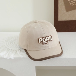 Detail of beige cotton baby cap with PUPII KIDS embroidery and brown brim piping