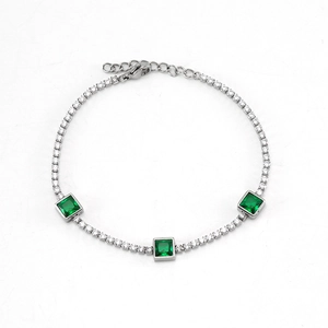 Elegant silver tennis bracelet with three emerald green stones and pavé set cubic zirconia