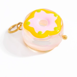 Pink and yellow donut glass pendant necklace with gold ring and resin texture