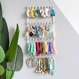 Wall-mounted 4-tier PU leather hair accessory organizer with wood rods and colorful bows