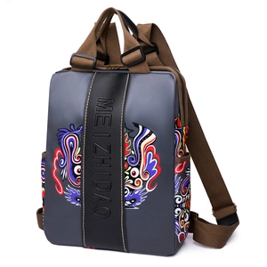 Women's grey fashion backpack with adjustable brown straps and colorful totem prints