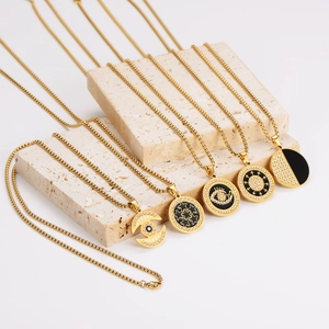 Golden stainless steel necklaces featuring zircon-set heart and evil eye pendants