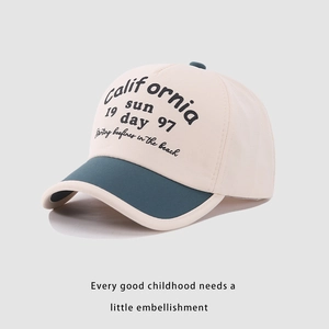 Detailed close-up of California Sun vintage lettering on child baseball cap