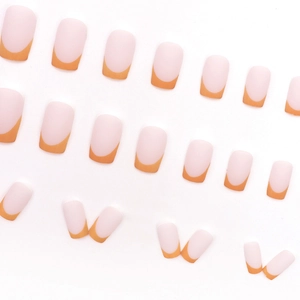 French tip press-on nails in matte orange and nude pink with square oval shape