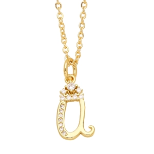 Macro shot of gold letter A pendant with crown design and sparkling white cubic zirconia