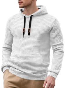 Detailed close-up of white waffle texture fabric on hoodie with black drawstrings