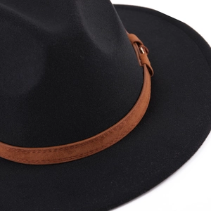 Detailed close-up of black wool felt fedora featuring a brown leather decorative band