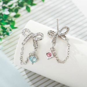Silver bow stud earrings with pink and blue cubic zirconia teardrop chain pendants