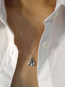 S925 sterling silver water drop pendant necklace on model with white shirt