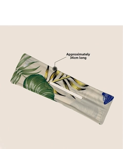 Detail view of 34cm bun maker with tropical leaf print and precise edge stitching
