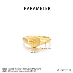 Detail view of a 7mm wide 18K gold plated stainless steel ring with star engraving