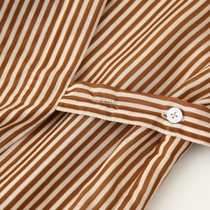 Striped long shirt dress with button-up detail and premium fabric texture