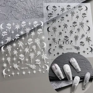 Detail of vintage gold liquid lily heart nail stickers with moon and star patterns