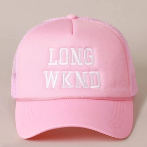 Macro view of pink trucker hat with white LONG WKND embroidery and mesh detailing