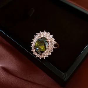 French vintage style gold-plated oval green gemstone ring with halo diamond setting