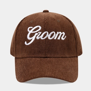 Close-up of Groom embroidery on brown corduroy baseball cap with high texture detail