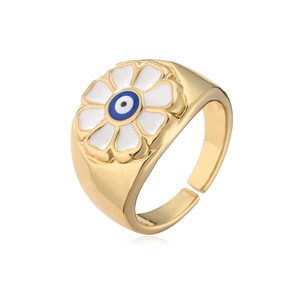 Detail of 18K gold plated ring featuring blue and white enamel evil eye flower motif