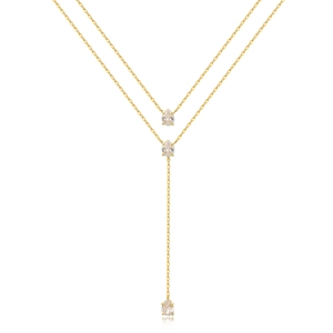 Detail of double-layer Y-shaped gold necklace featuring three pear-cut emerald crystals