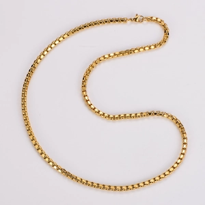 Close-up of a polished golden stainless steel box chain necklace with 304 grade quality