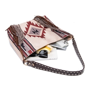 Interior view of tribal geometric tote bag showing laptop, phone and accessories storage