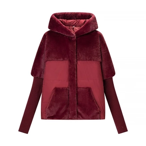 Deep red hooded winter jacket featuring faux fur trim and knit ribbed sleeves for women