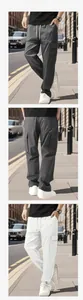 Detail of men's cargo pants showing elastic drawstring waist and large side flap pockets