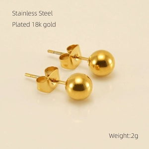 Detail of 18K gold plated stainless steel ball stud earrings with butterfly backs
