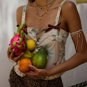 Elegant floral tie-up bandeau top with gold arm band and multi-layer necklace