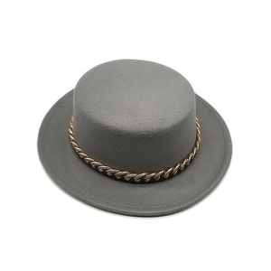 Elegant grey flat top wool felt hat with decorative gold chain link band on white background