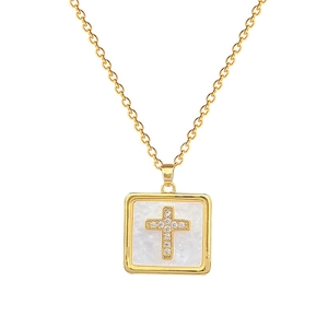 Luxurious gold square pendant necklace with sparkling diamond cross on white pearl base