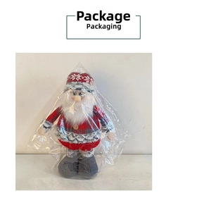 Detailed view of Santa Claus plush doll in red snowflake hat and plaid outfit in packaging
