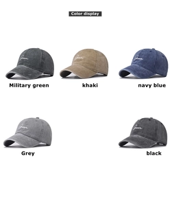 Detail showing high-quality Groom embroidery on various washed cotton baseball caps