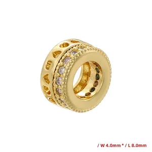 Detail view of gold honeycomb charm with zircon stones, measuring 4.0mm by 8.0mm size