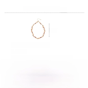 Detail of beaded necklace showing dimensions and textures of mother-of-pearl and stone
