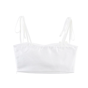 Detail of white cropped camisole featuring tie-up shoulder straps and textured fabric