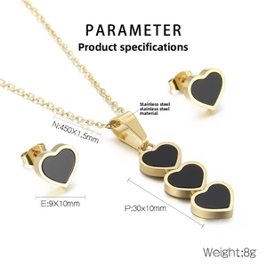 Detail of gold stainless steel necklace and heart earrings set with size parameters