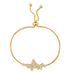 Detail of gold butterfly bracelet featuring white cubic zirconia and adjustable pull clasp