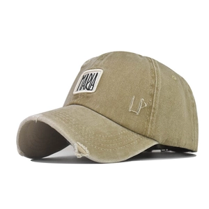 Detailed close-up of distressed cotton baseball cap with MARIA patch and LA embroidery