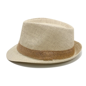 Detail of beige straw fedora hat featuring a brown textured woven decorative band