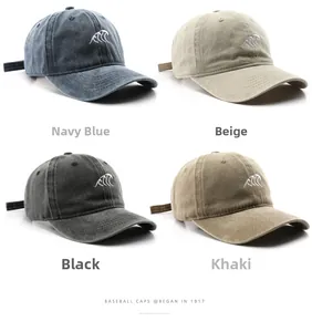 Detailed grid view of four washed cotton baseball caps in navy, beige, black, and khaki
