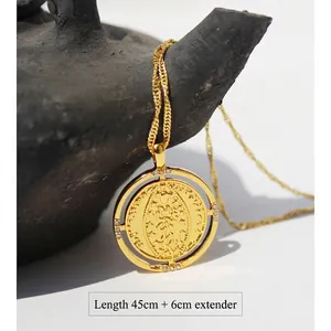 Vintage gold relief round pendant necklace with zircon detailing on dark stone base
