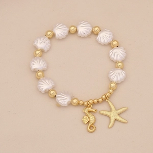 Detailed close-up of beaded ocean bracelet with golden seahorse and starfish charms