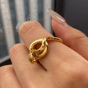 Snake shaped stainless steel ring in gold finish featuring white zircon stone detail