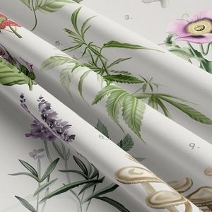 Close-up of botanical tapestry fabric showing detailed mushroom and flower prints