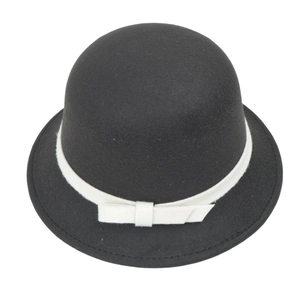 Detailed macro view of French vintage cloche hat with white ribbon and wool felt texture